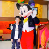 A live Mickey Mouse character bringing classic fun to the birthday party
