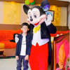 A live Mickey Mouse character bringing classic fun to the birthday party