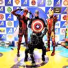 Iron Man posing with excited kids