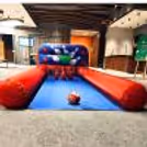 An Inflatable Bowling Alley Stands Out As A Vibrant And Engaging Activity Zone For The Events