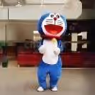 Doraemon mascot character greeting guests at an outdoor kids' birthday party and event entertainment setup.