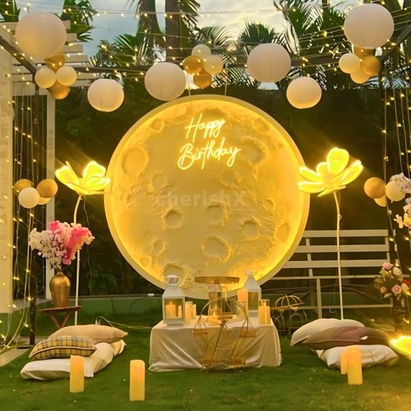 Celestial Celebration - Celebrate with a stunning moon backdrop and Happy Birthday neon signage