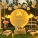 Celestial Celebration - Celebrate with a stunning moon backdrop and Happy Birthday neon signage