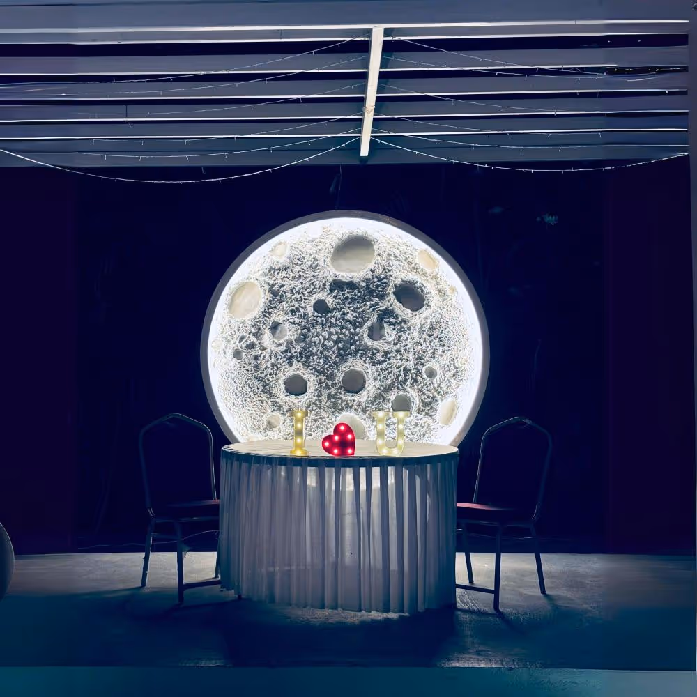 Enchanting Table Setup - Candlelit "I Love You" arrangement with heart-shaped rose petals.