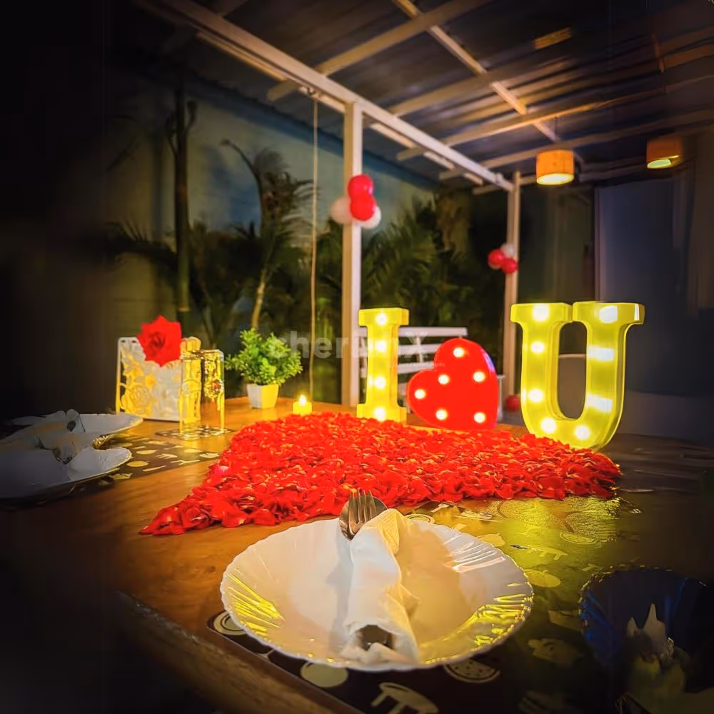 Romantic Centerpiece - Candlelit "I Love You" and heart-shaped rose petal decoration for a magical touch.