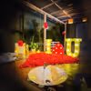 Romantic Centerpiece - Candlelit "I Love You" and heart-shaped rose petal decoration for a magical touch.