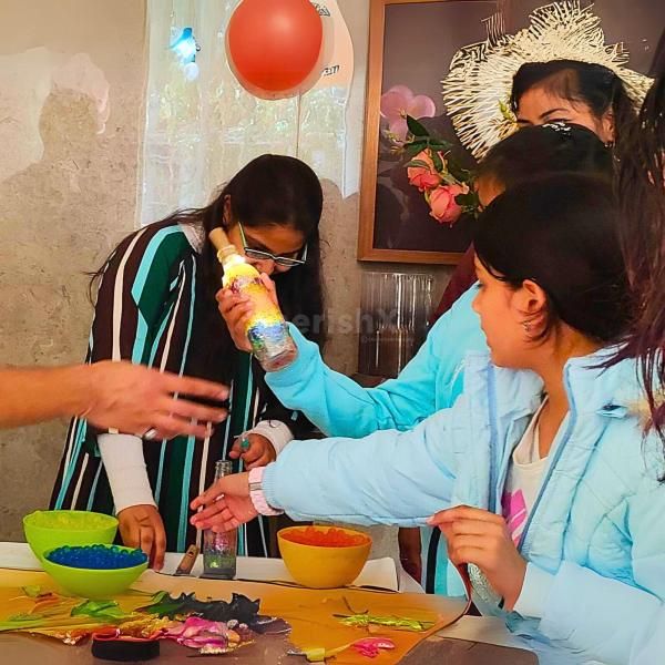 Kids exploring science with a Light Up Bottle project!