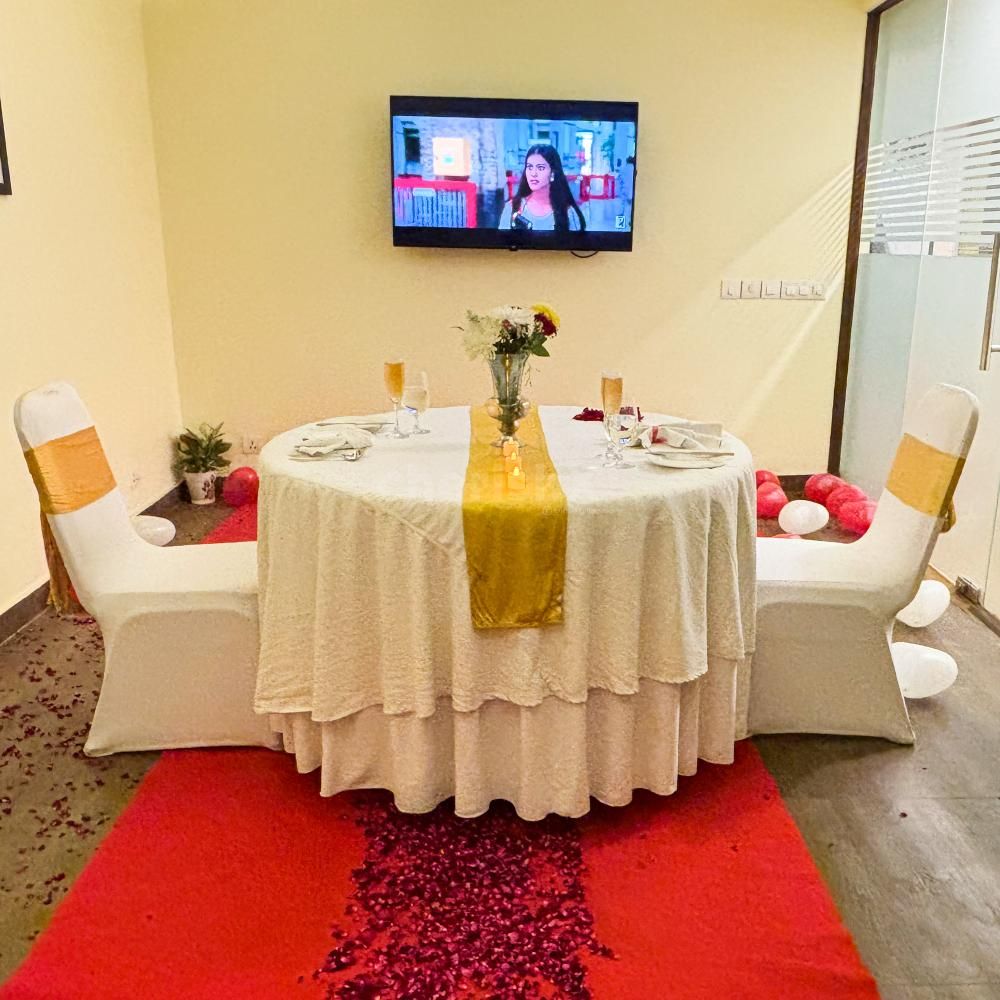 Experience a romantic private movie night with elegant table decor.