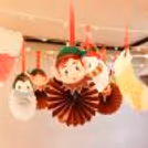 A merry atmosphere with vibrant rosettes and paper cutouts