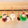 Celebrate Christmas with colorful paper rosettes and festive lights