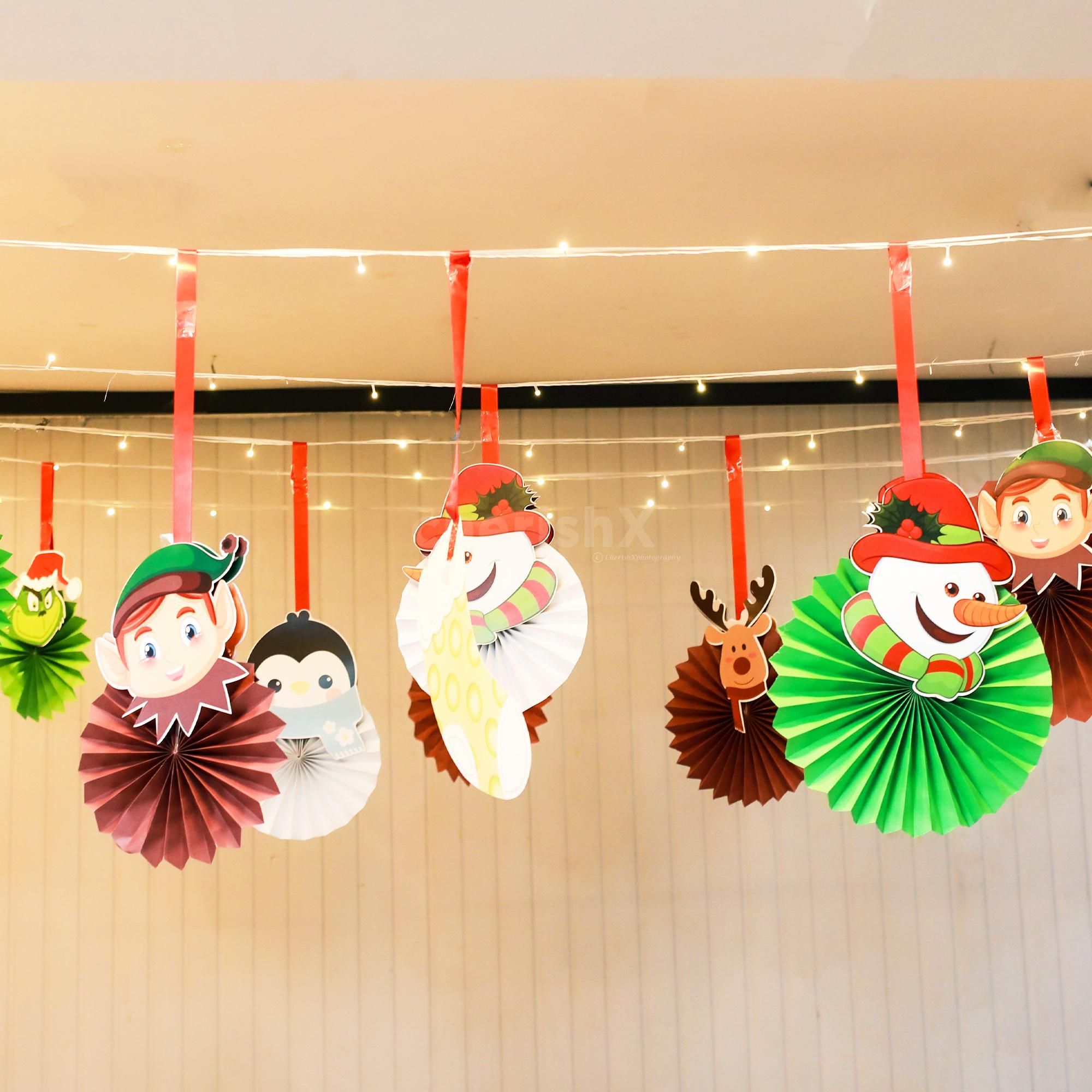 Celebrate Christmas with colorful paper rosettes and festive lights