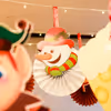 Twinkle lights and paper cutouts make for a cozy holiday ceiling