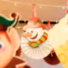 Twinkle lights and paper cutouts make for a cozy holiday ceiling