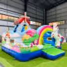 Kids have fun jumping and playing in this colorful unicorn-themed bouncy setup.