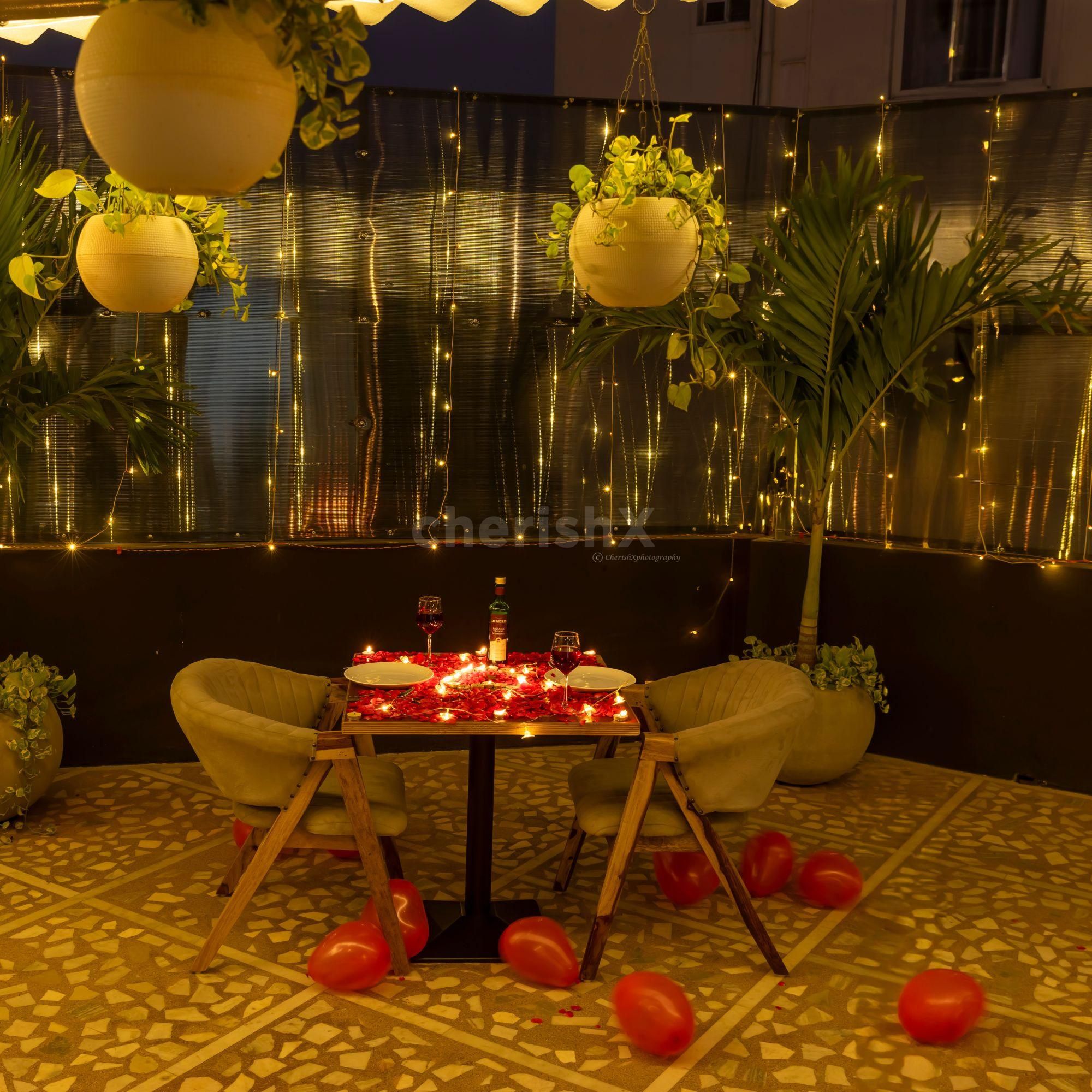 A romantic setup with glowing candles and flower petals awaits you.