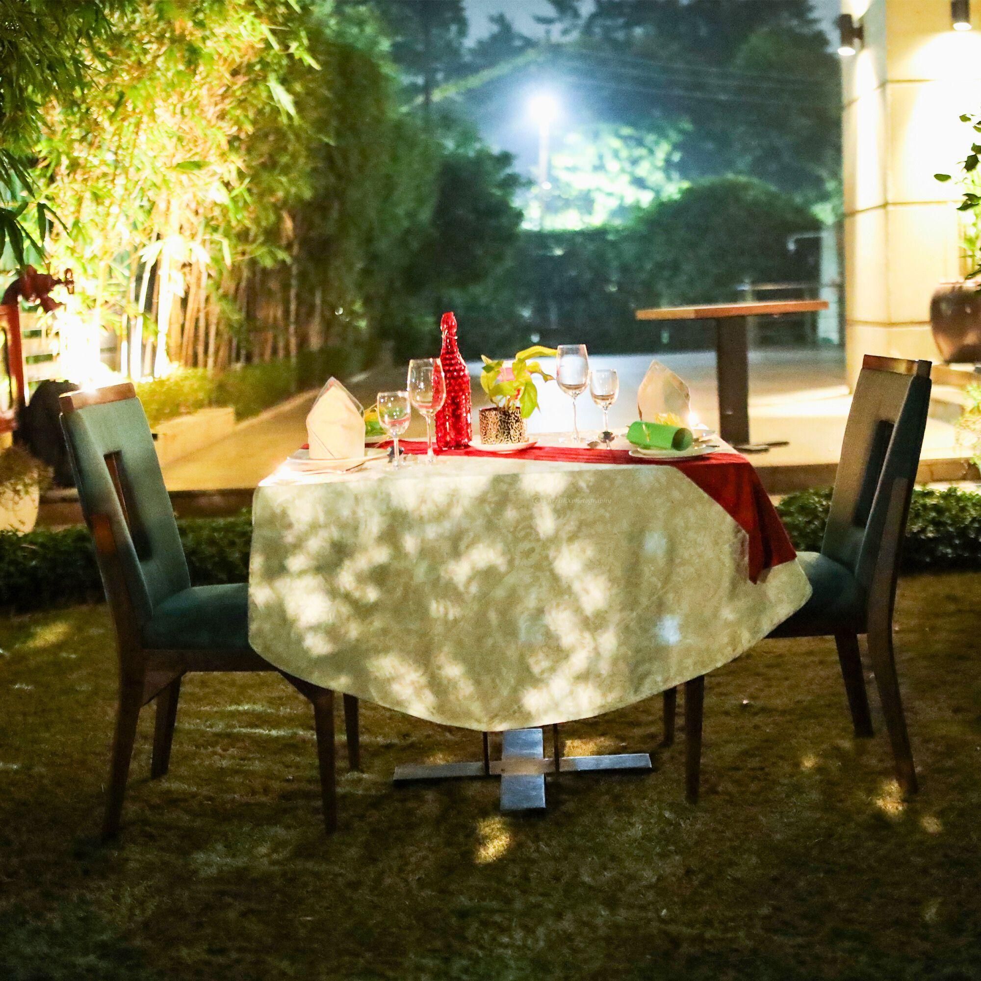 Experience the charm of an open garden dining setup under the open sky