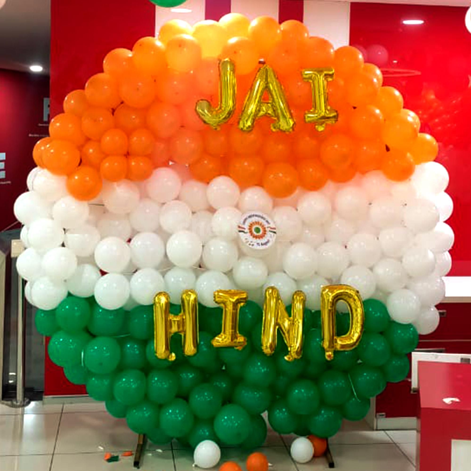 A patriotic reception area featuring flags, doves, and an Ashoka Chakra.