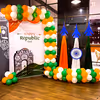 Celebrate freedom with a vibrant tri-colour balloon backdrop.