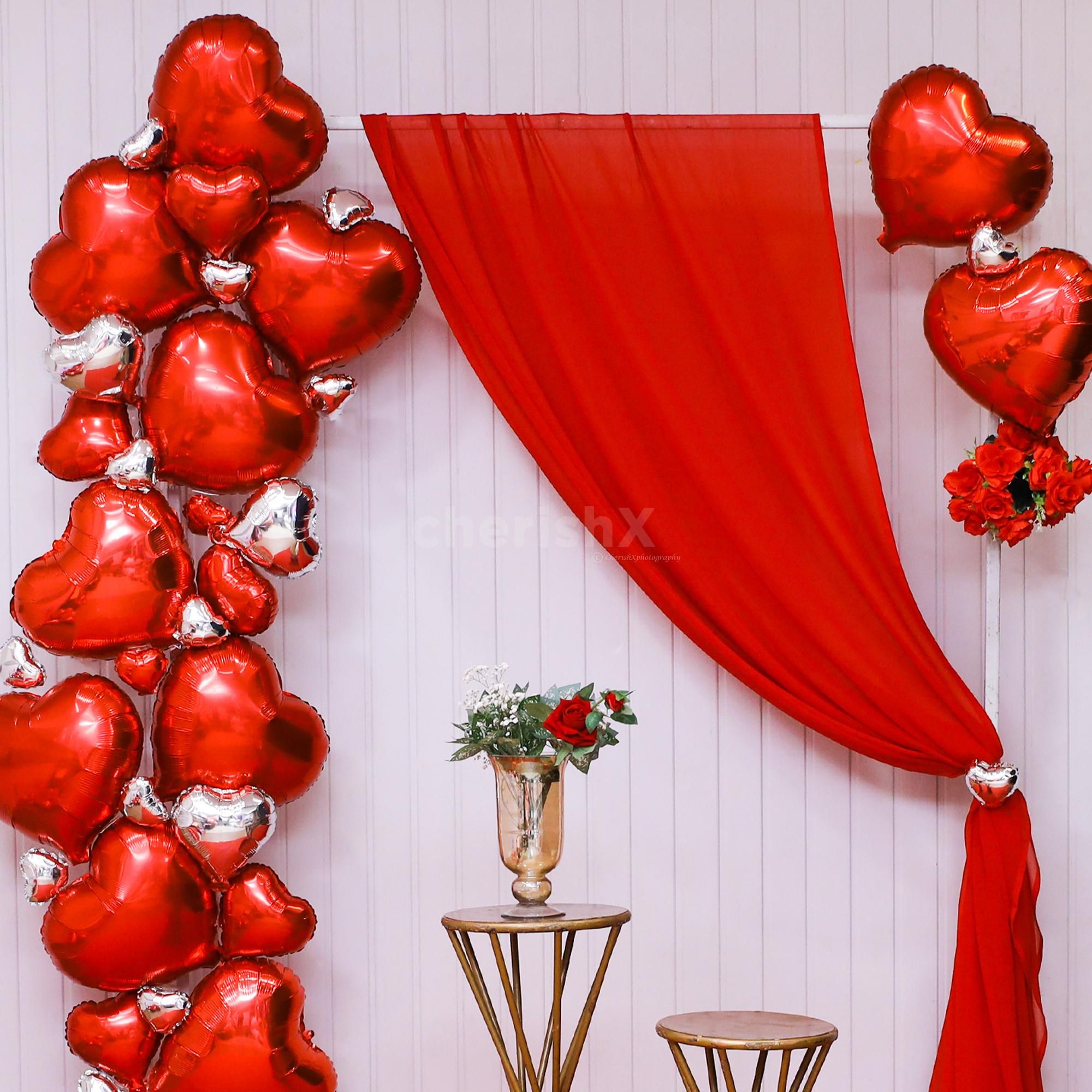 A dreamy romantic setup with great heart-shaped balloons and floral accessories.