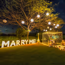 Celebrate love with dramatic light, flowers, and romantic pathways!