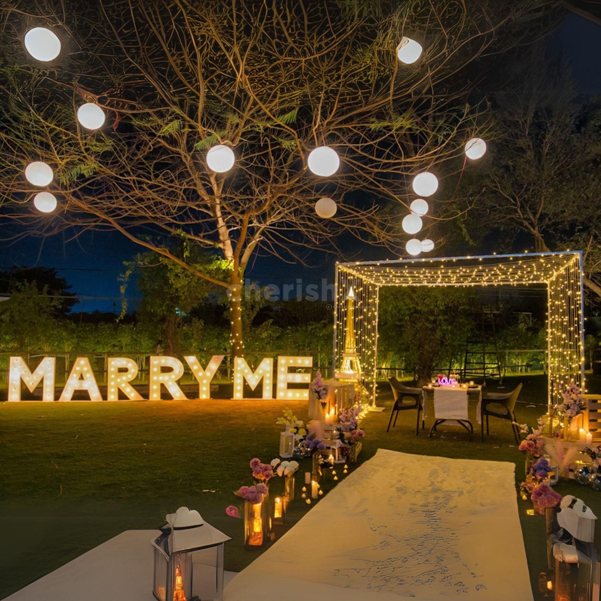 Propose under the glow of the Eiffel Tower with a beautiful flower-filled base!