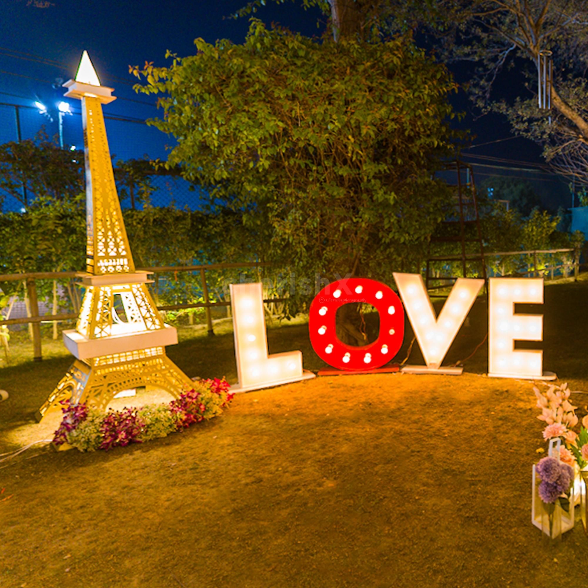 Transform your special moment with a dreamy Eiffel Tower and cozy canopy setup!