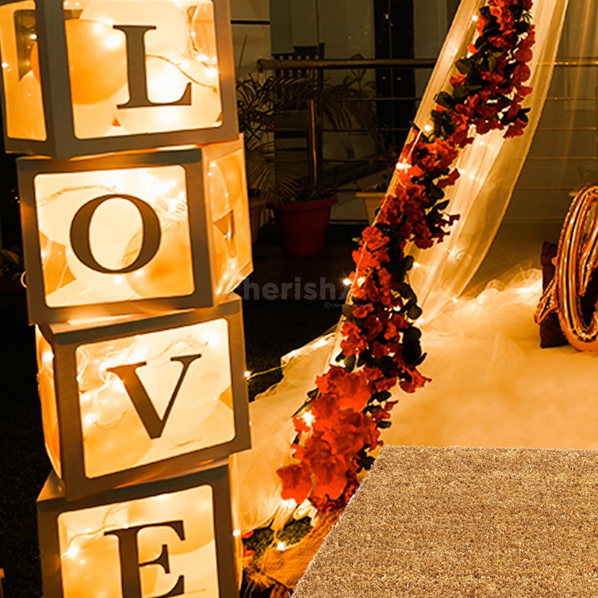 The surrounding of the canopy is decorated with LOVE Boxes, Balloons and Red flower vines.