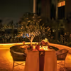 Romantic ambiance with flower decorations and glowing candlelights.