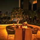 Romantic ambiance with flower decorations and glowing candlelights.
