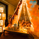 The surrounding of the canopy is decorated with LOVE Boxes, Balloons and Red flower vines.