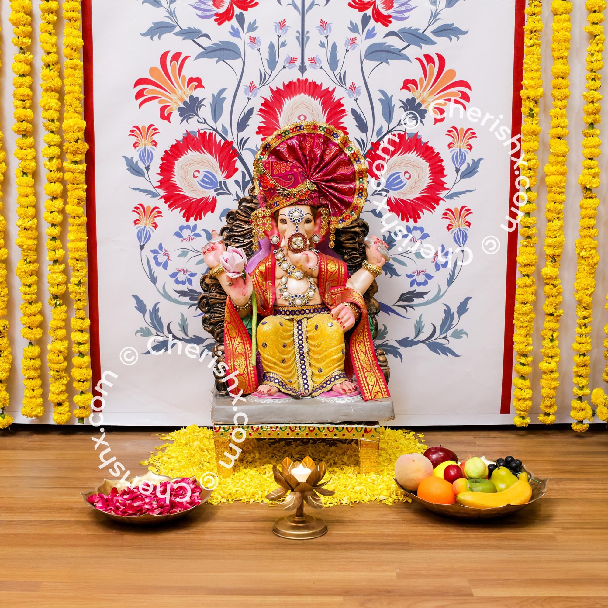 Marigold garlands on the flex add to the celebration charm