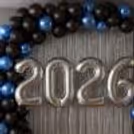 2026 Foil balloons float in the air with shiny silver glitter to add perfection to the decoration