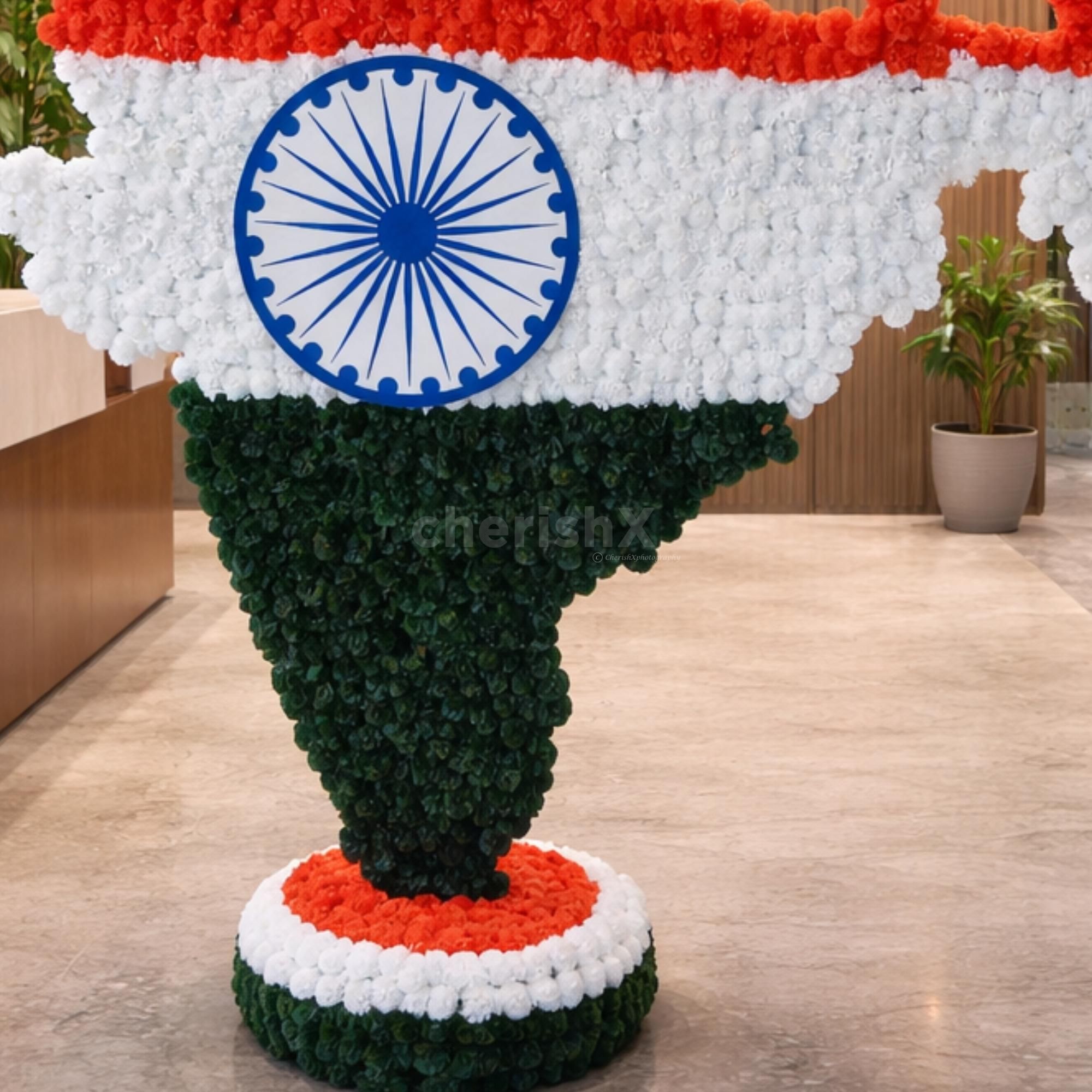 The base of the cutout is also covered in tricoloured flowers to complement the photobooth.