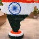 The base of the cutout is also covered in tricoloured flowers to complement the photobooth.
