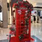 Stylized photo-ready phone booth in red Valentine decor, blending vintage charm with modern celebratory vibes.
