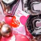 Bunches of baby's breath add a natural touch to the balloon shapes.