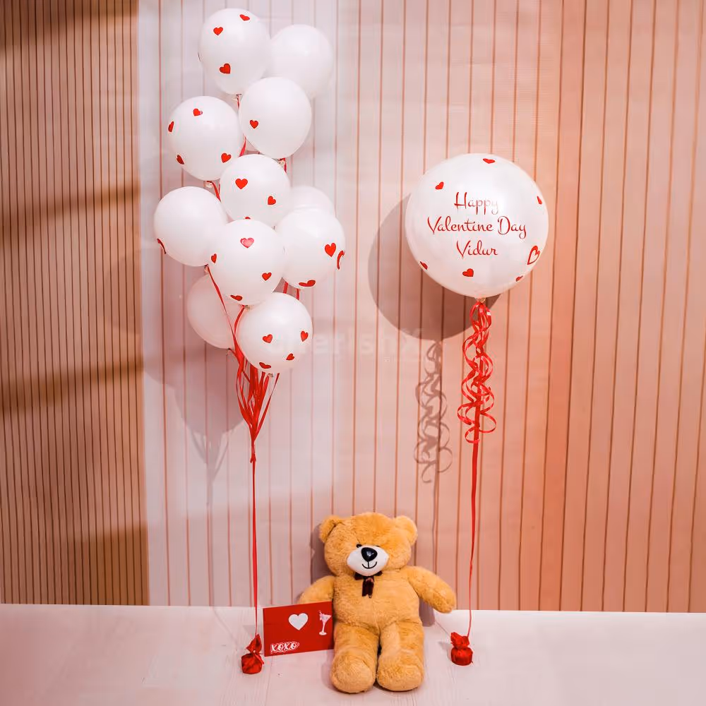 White latex balloons with red heart vinyl stickers look attractive for Valentine's Day.