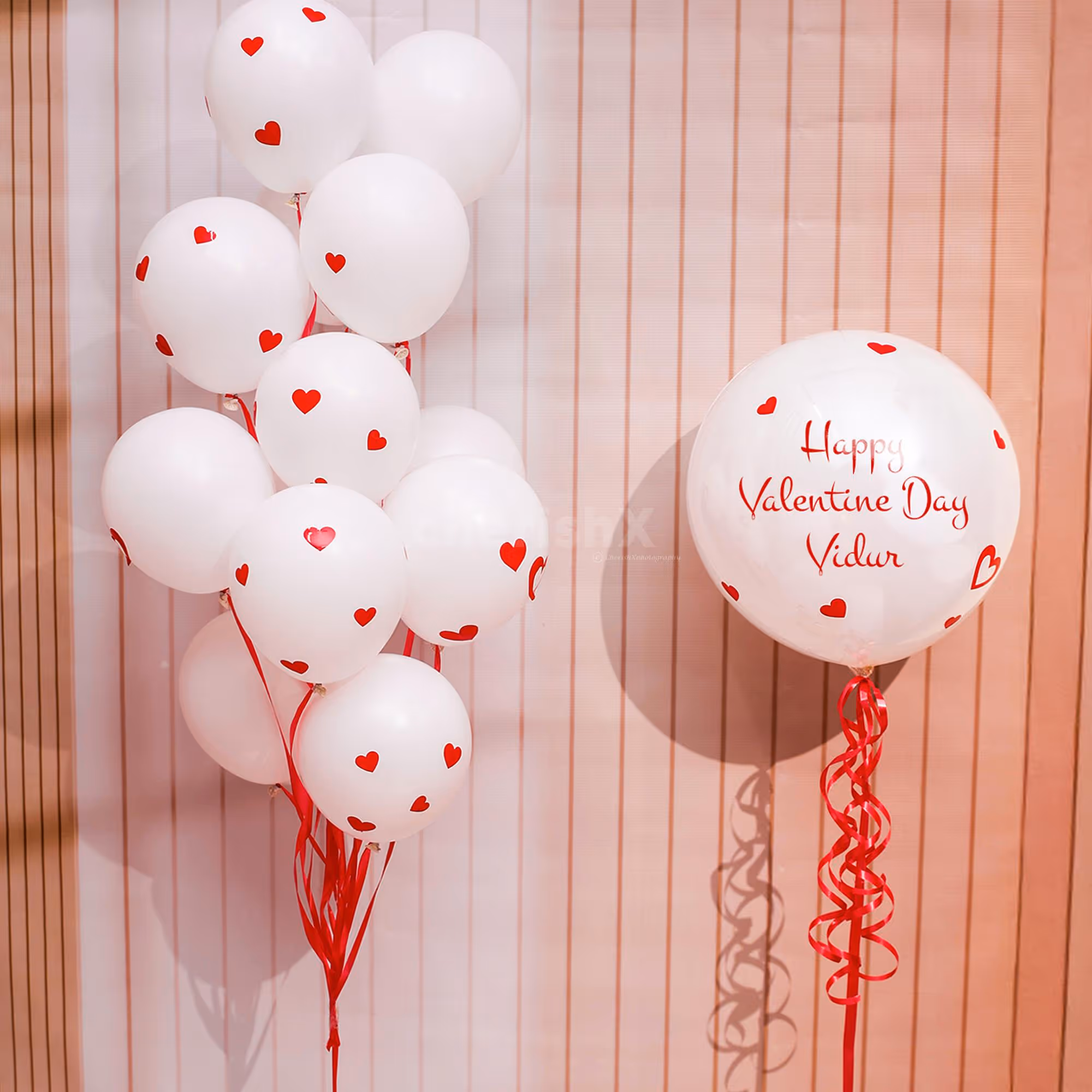 Heart-shaped vinyl stickers cast a ruby-like reflection when light strikes them.