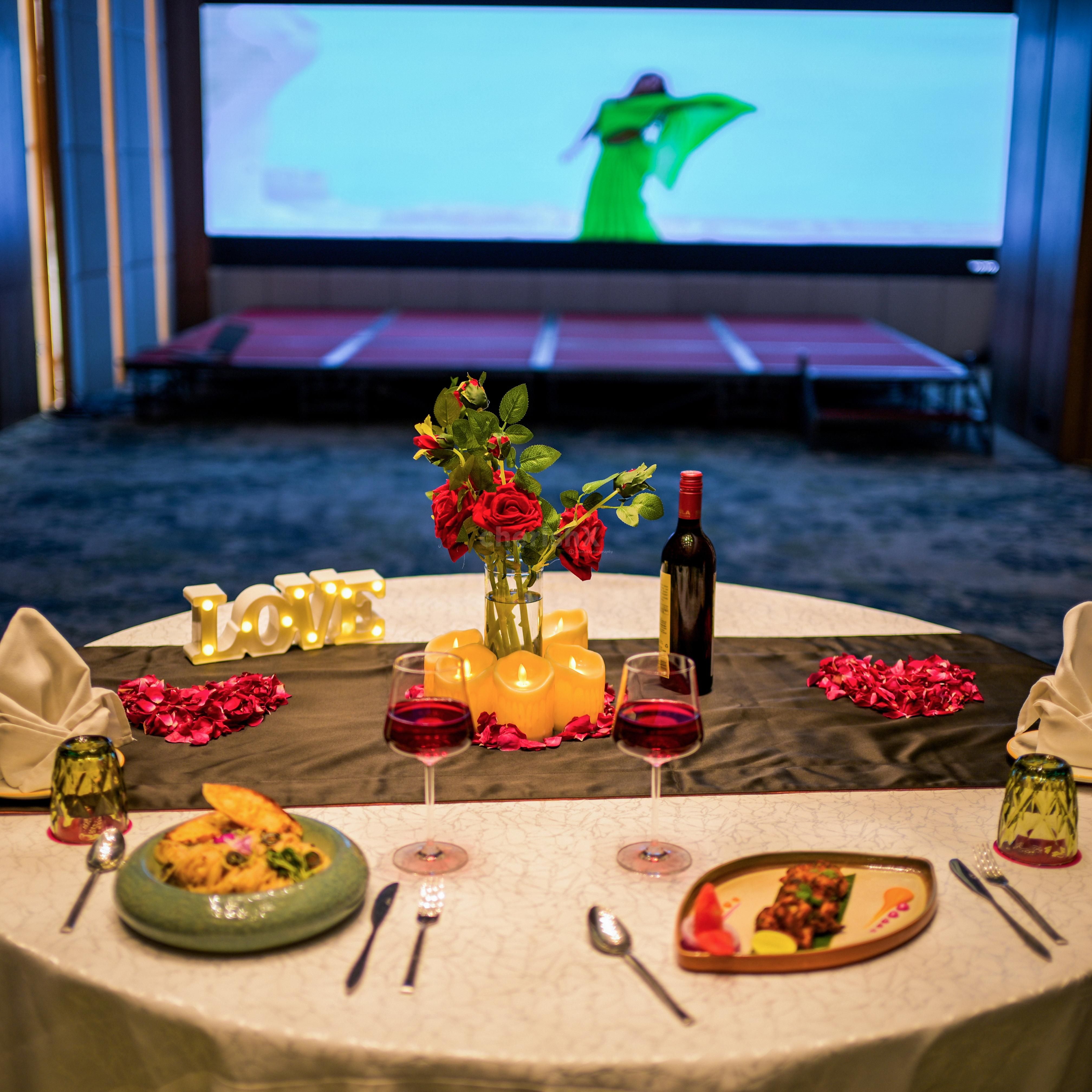 Private indoor dining experience with audio-visual setup for OTT content