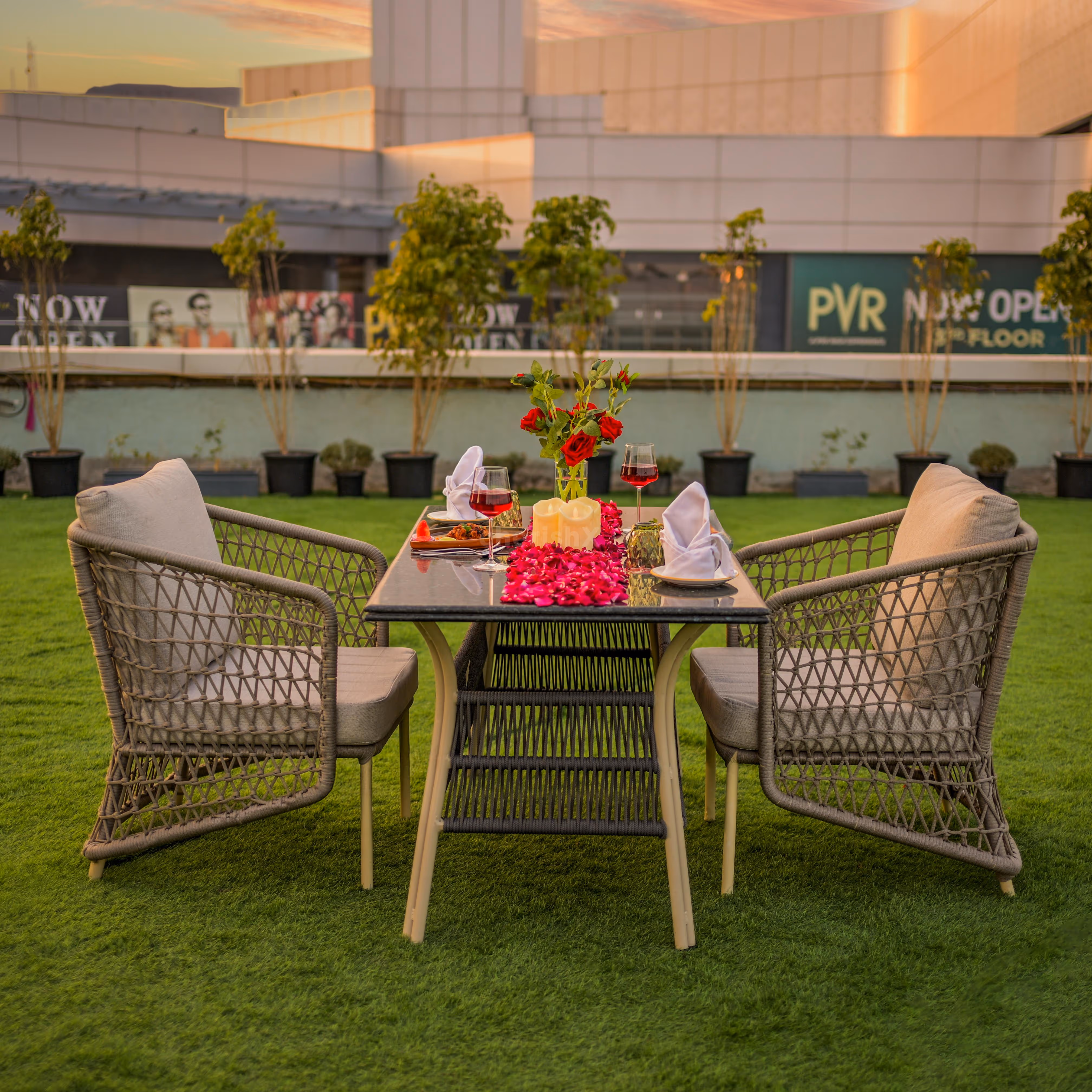 Valentine’s Day lunch date setup with candles and petals at Ramada Encore, Dwarka Expressway