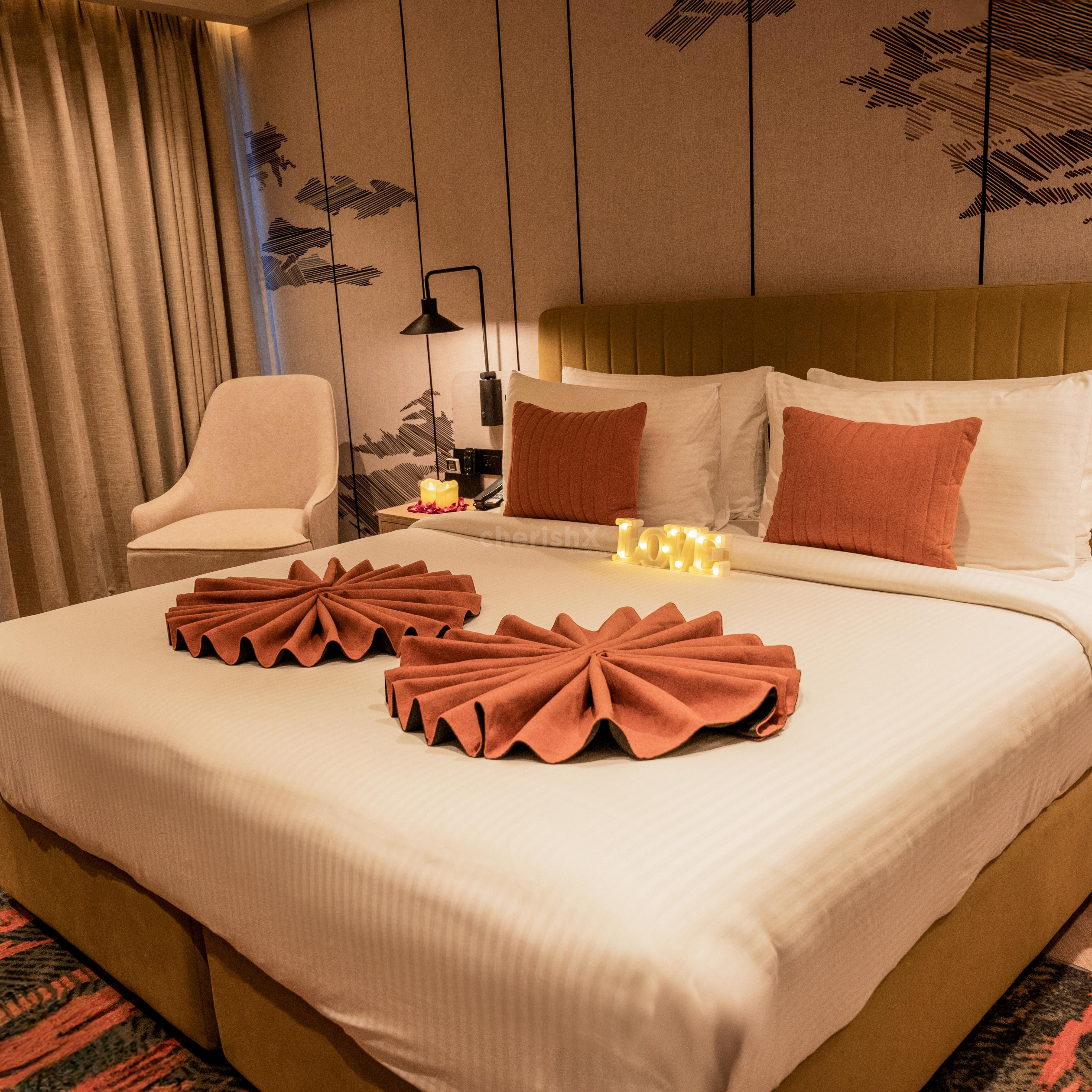 Comfortable hotel room setup for a romantic night stay at Ramada Encore