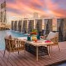 Poolside candlelight dinner during a romantic overnight staycation