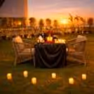 Open-air terrace candlelight dinner setup at Ramada Encore, Dwarka Expressway