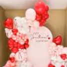 The baby announcement is emphasized by a customized sunboard cutout on the stand.