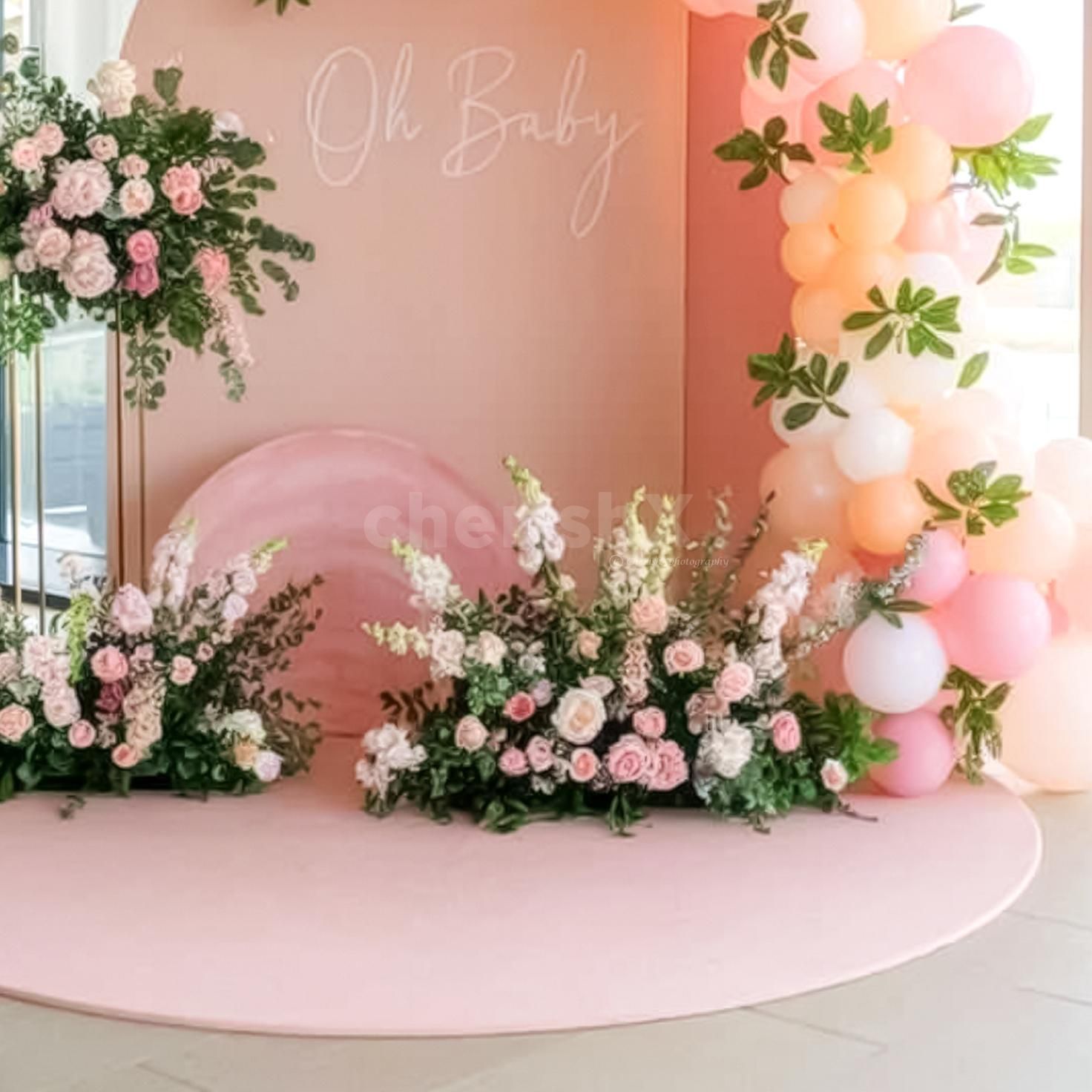 A pastel balloon arch adds elegance and balance.