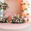A pastel balloon arch adds elegance and balance.