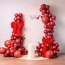 Red velvet big bows make the setup look more gift-wrapped and inviting.