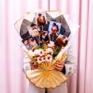 A scrapbook-inspired Bouquet with real-time pictures adds personal flair to the gift.