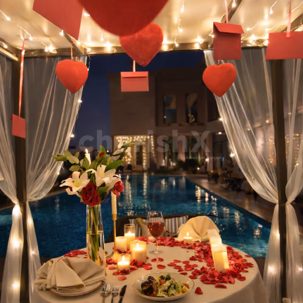 Couple dining at open-air cabana by the rooftop pool