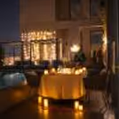intimate rooftop poolside candlelight dinner under the open sky